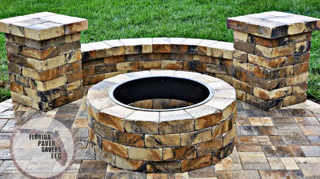 Masonry fire pit with a curved seating wall