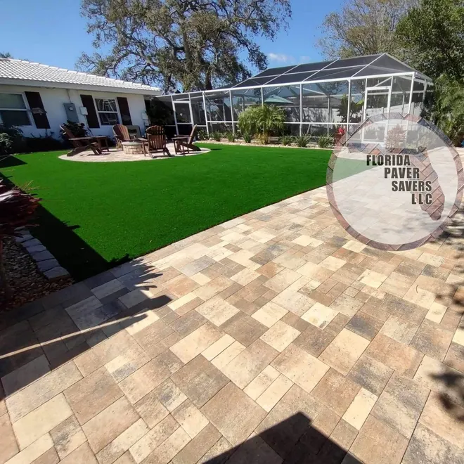 Artificial turf courtyard surrounded by pavers
